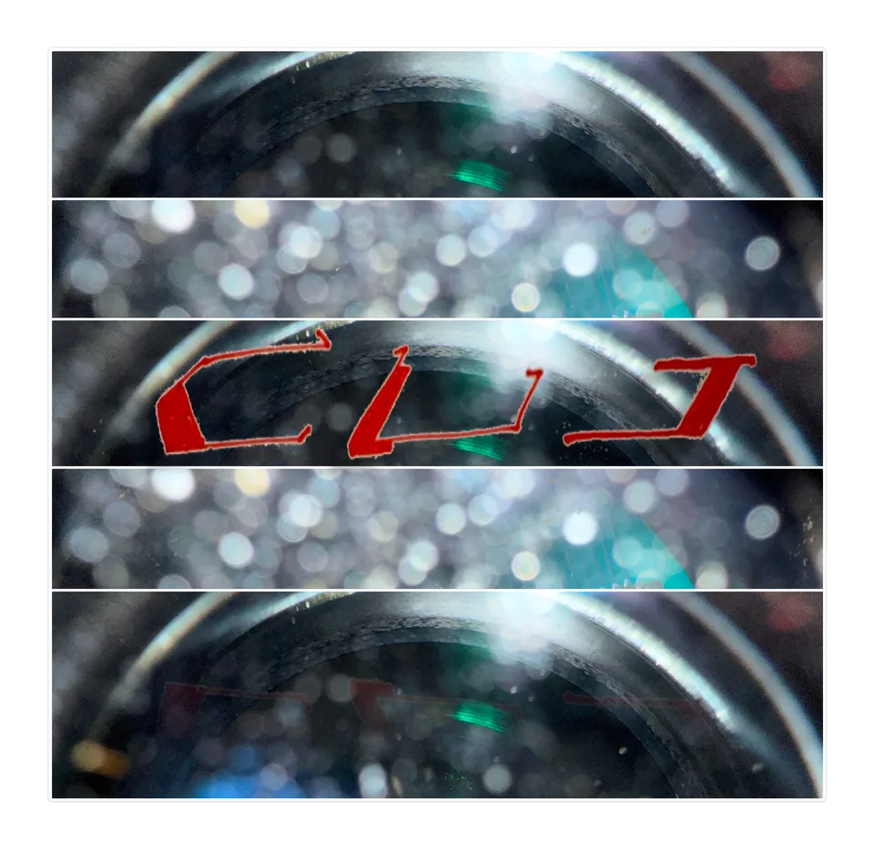 Red CUT wordmark framed between bands of out-of-focus glass and light