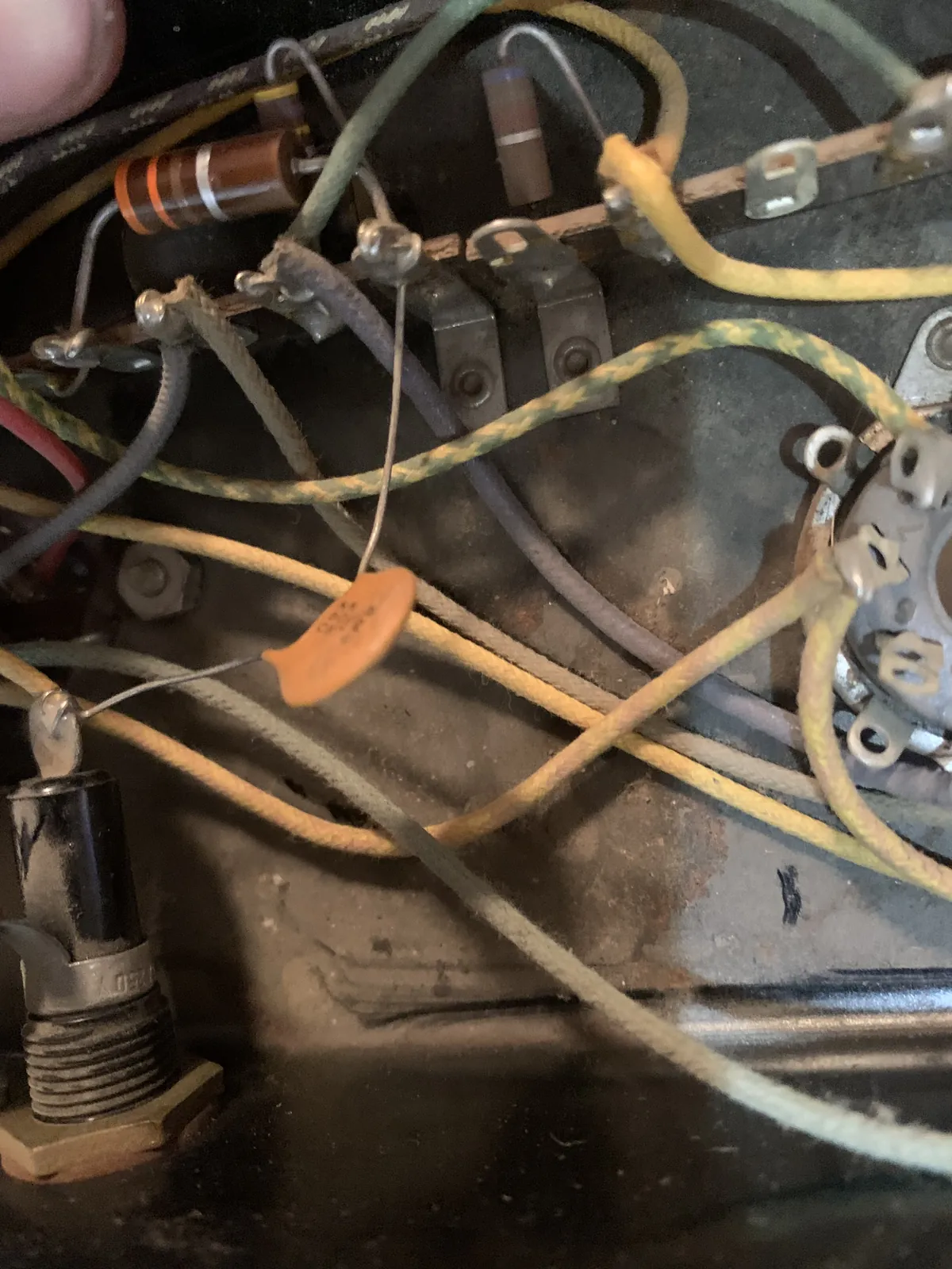 Close-up of original cloth wiring and an orange disc capacitor