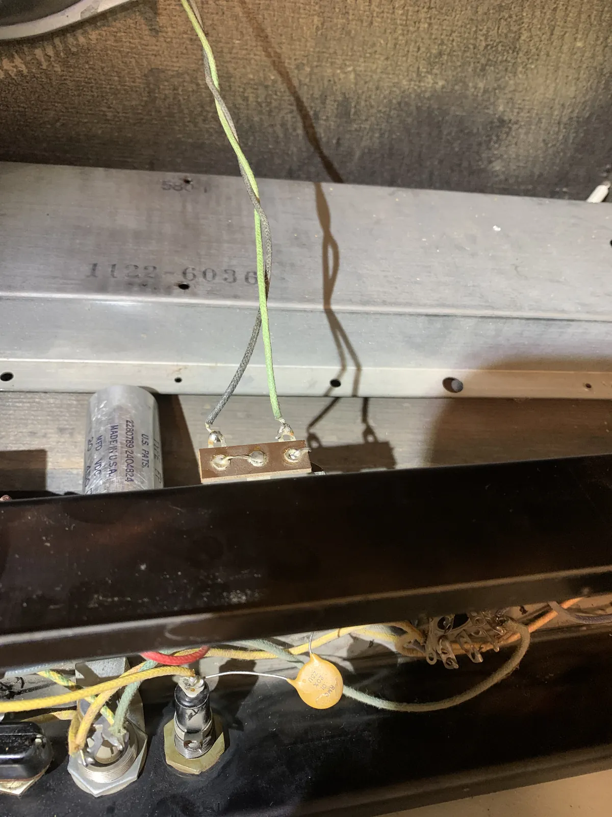 Line cord leads at a terminal strip under the chassis
